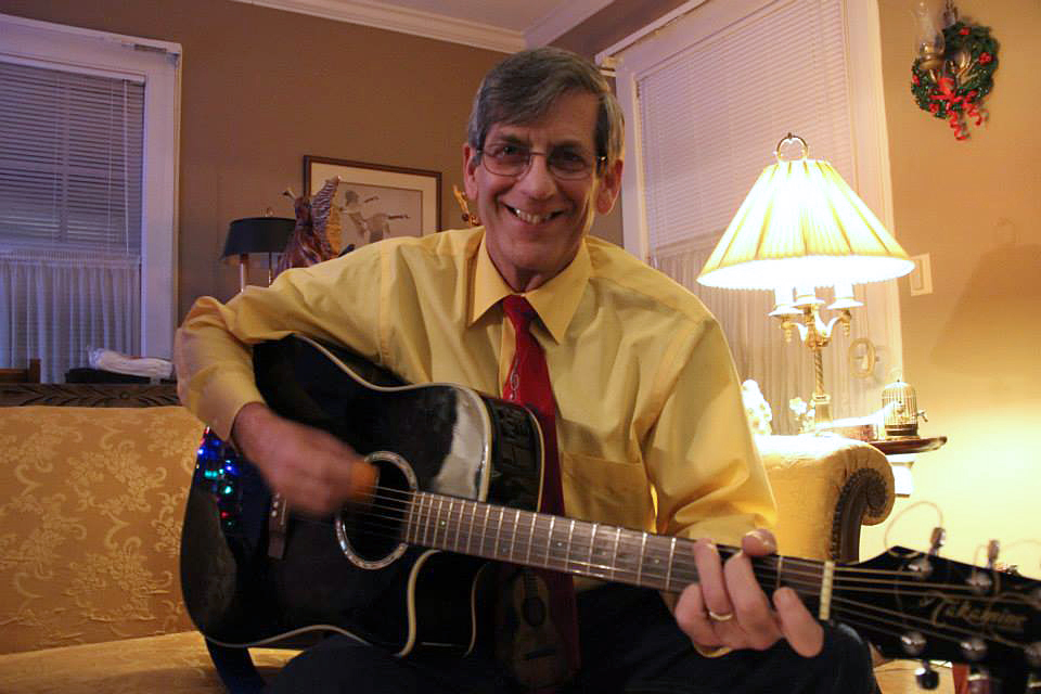 Photo of Bruce Bonini with his guitar